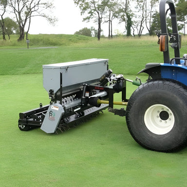 side view of first products UA80 aera vator with seed box attachment installed