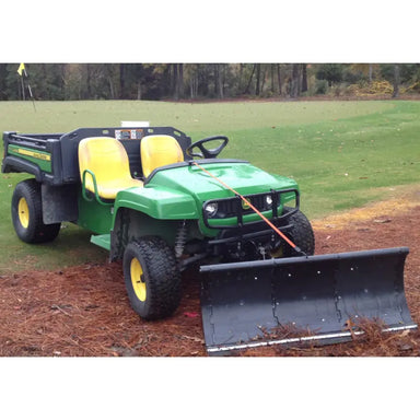 Front view of green UTV with 64" Nodic Plow installed