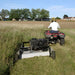 AcrEase MR55B 57 in 23HP Rough Cut Tow Behind Mower rear view pulled by atv in tall grass field