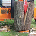 Closed Up view of the red log splitter on the center of a log