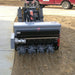 front view of a man operating the DO40 AERA-vator Mini Skid Steer