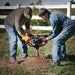 Two person operating the Earthquake Dually™ Earth Auger Powerhead