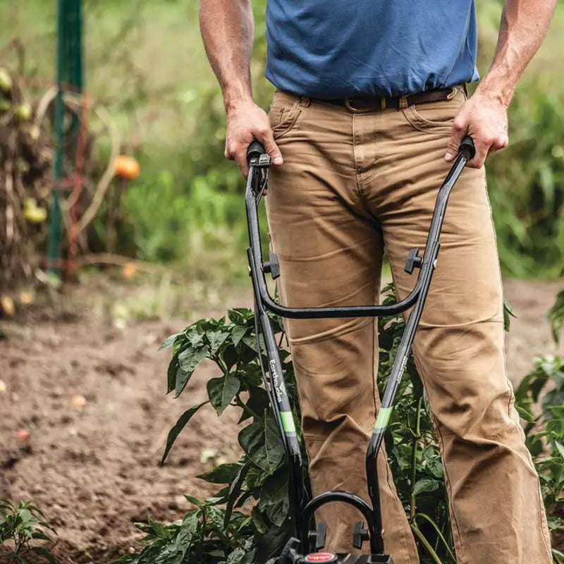 closed up image of a man holding the U-Turn Handlebar of Earthquake MAC Cultivator