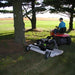 Finish Cut Mower AcrEase Model H40B by Kunz Engineering under a tree towed by ride on lawn mower