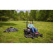 Man driving his lawn tractor with Swisher FC14566CPKA 66" Finish Cut Mower mounted on it