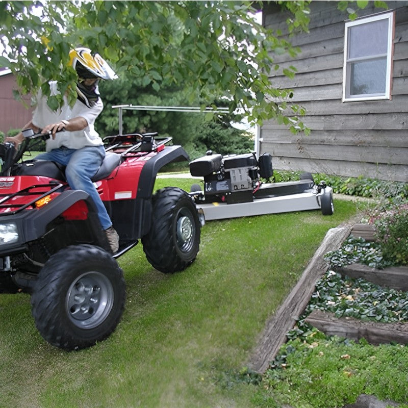 Kunz H40B Finish Cut Mower AcrEase 10.5 HP being towed by woman on atv