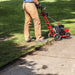 Man Clearing The driveway using Earthquake Walk Behind Lawn Edger 79cc Viper Engine