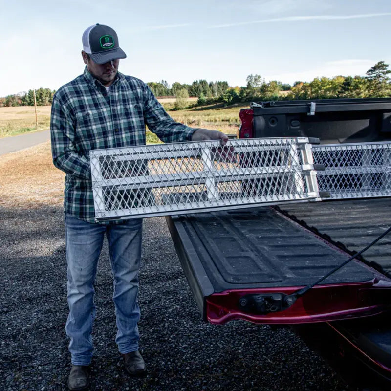 man folding this Yutrax  89" Folding XL Aluminum Arch Ramp