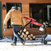 Man dragging the earthquake 5 ton electric log splitter with stand and tray