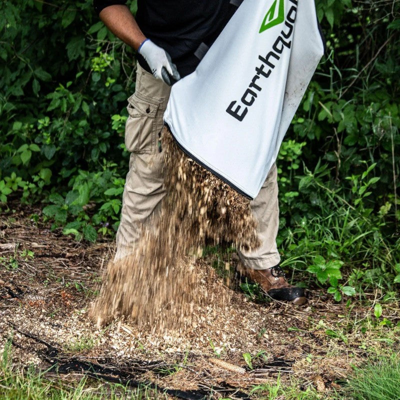 Man dropping the Mulched from Earthquake K32 Chipper Shredder Bag