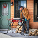 Man operating the earthquake 5-ton electric log splitter with stand and tray