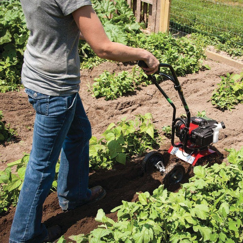 Rear view of the Earthquake MC43 Cultivator Tiller Engine Left Side View in garden