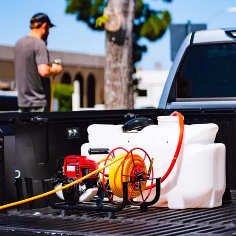 Tomahawk 1.6HP Skid Sprayer Mount Honda GX35 100ft Hose 500 PSI Pump mounted at the back of a truck