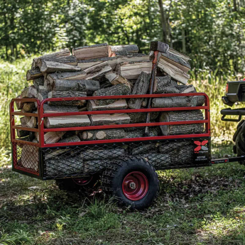 side view of Yutrax HC1750 ATV Trailer full of Logs