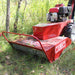 closed up view of the front part of the maxim brush cutter on the grassy lawn