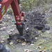 NorTrac Ripper Attachment mounted on NorTrac Towable Trencher while digging on the soil