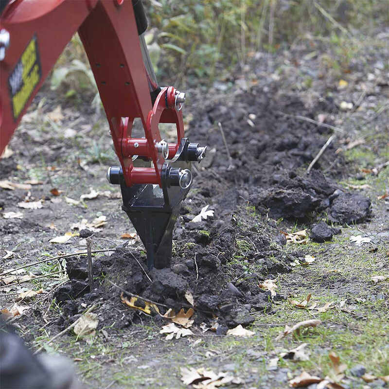 NorTrac Ripper Attachment mounted on NorTrac Towable Trencher while digging on the soil