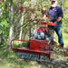 man operating his maxim MBC190H brush cutter with a tree branch on the front on the cutter