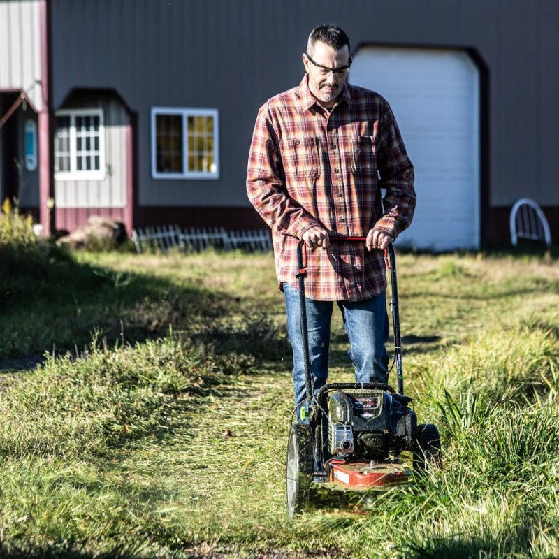 front view of man mowing lawn with the Walk Behind String Mower 163cc Briggs