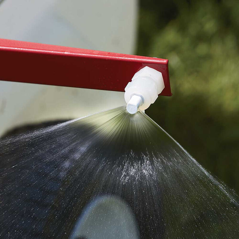 front of a sprayer nozzle with a high pressured water in V shaped 