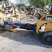 Iron and Oak  Log Splitter  mounted on the Iron and Oak Skid Steer Log Splitter with a log stuck on the wedge and ram