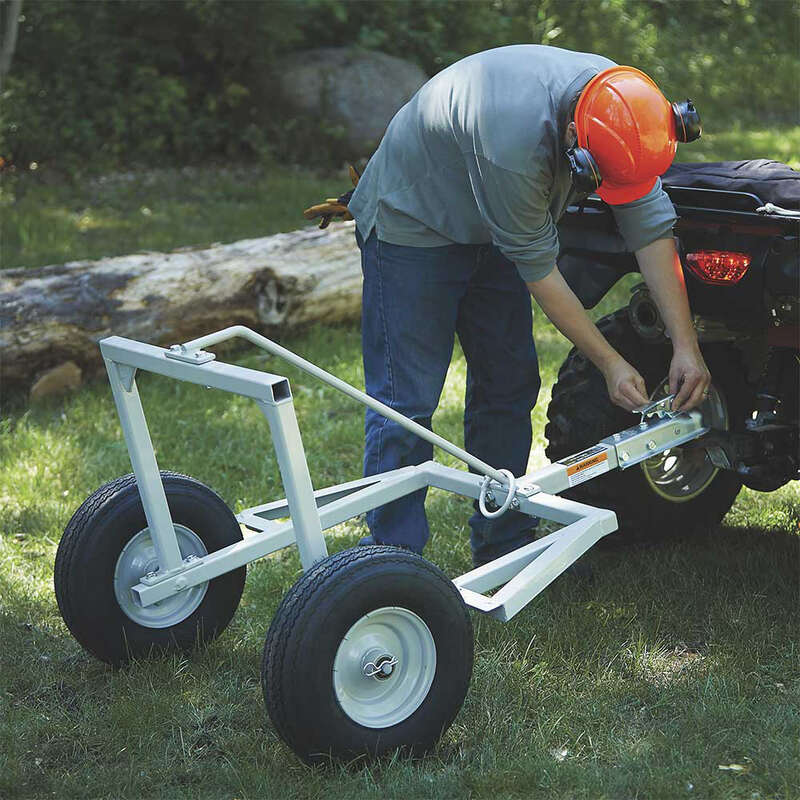 man installing the Strongway ATV Log Skidding Arch on his ATV