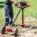 man drilling hole with Earthquake 43099 Outrigger Auger Torque Reducer attached on the Earthquake Dually Powerhead