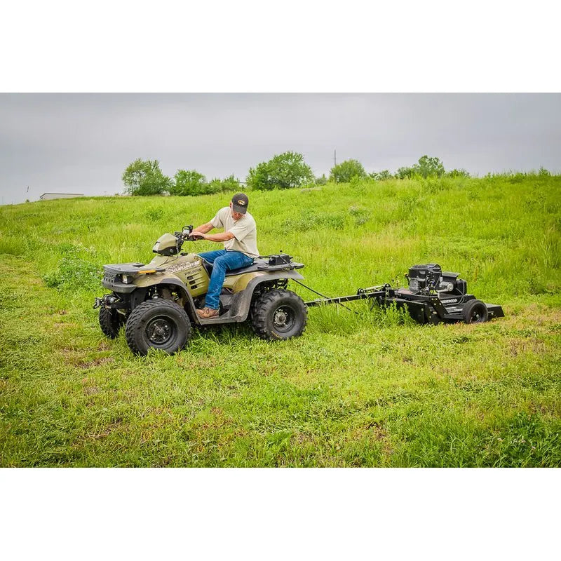 man driving ATV with Swisher 44 Inch Rough Cut Tow Behind Trail Cutter | RC14544CPKA