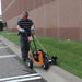 man fining the edge of the roadside with BravePro Star Blade Lawn Edger