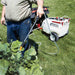 man spraying plants using NorthStar Tow-Behind Broadcast and and spot Sprayer with his left hands 