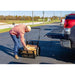 man loading chopped firewoods into his  Firewood Utility Cart 