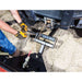 Man inserting the pin on the hitch of plow blade and UTV