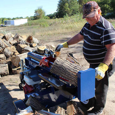 man operating the log splitter in horizontal position with a log which was split in half