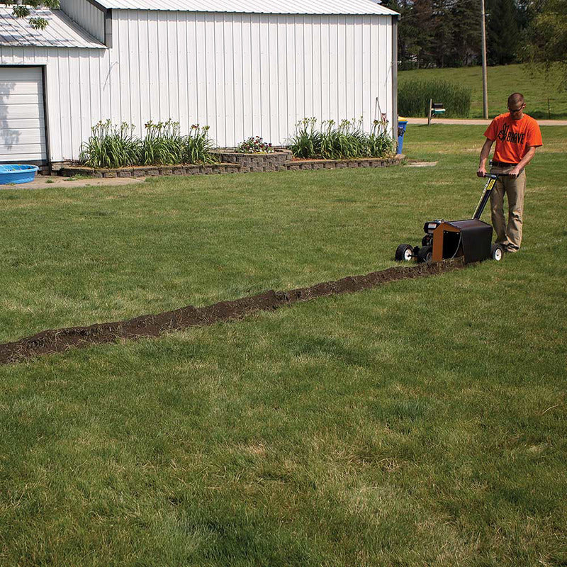 Man operating the  Brave Pro Trencher Clay Rotor Edger 7in. with Honda GX200 196cc(BRPT704H)