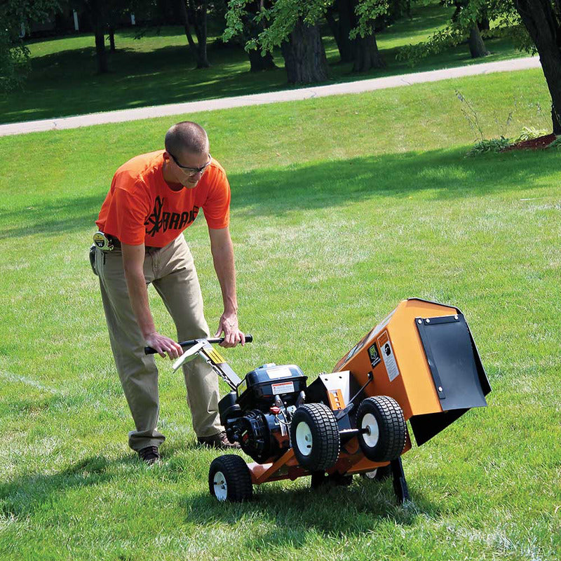 Man in Orange shirt Operating the  Brave Pro Trencher Clay Rotor Edger 7in. with Honda GX200 196cc(BRPT704H)