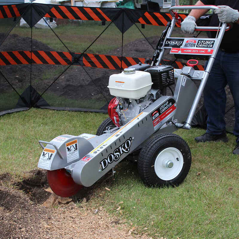 closed up view Dosko  Swivel Stump Grinder with a man holding the handle