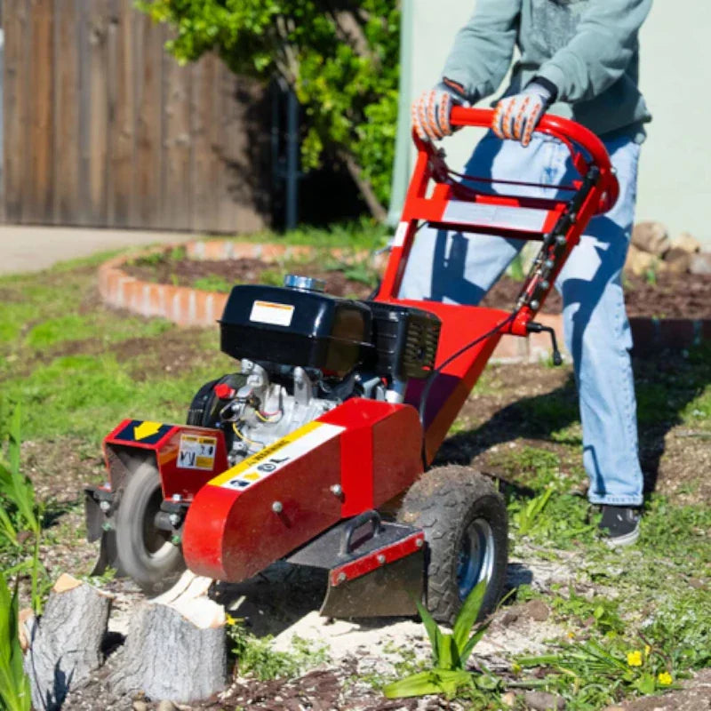 Man grinder the Stump on his Lawn Using Tomahawk Stump Grinder With 12" Blades 13HP Honda GX390 Off-Road Tree Stump Removal