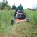 man riding his atv with BravePro 44 Inch Rough Cut Tow Behind Trail Cutter (BRPRC108HE) mounted on it