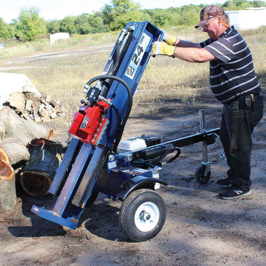man tilting the Iron and Oak Tow Behind Log Splitter