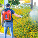 Man spraying pesticid Tomahawk 4.75 Gallon Battery Powered Backpack Sprayer