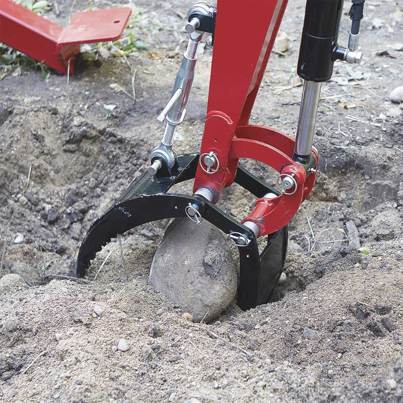 close up view on the towable trench arm with Nortrac rock grabber installed