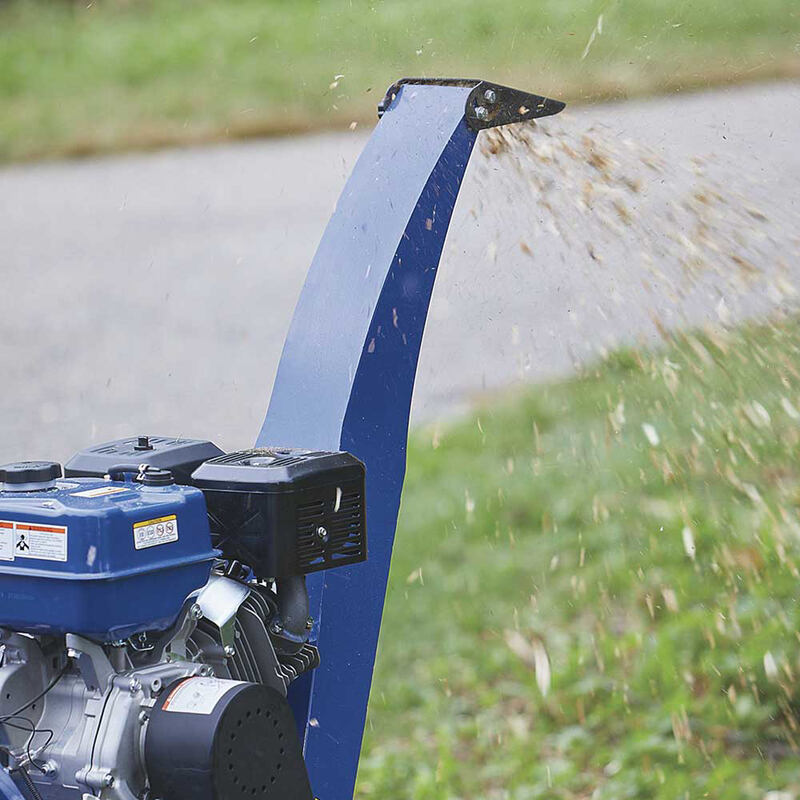 Powerhorse Towable Wood Chipper/Shredder  with mulch flying out the blower