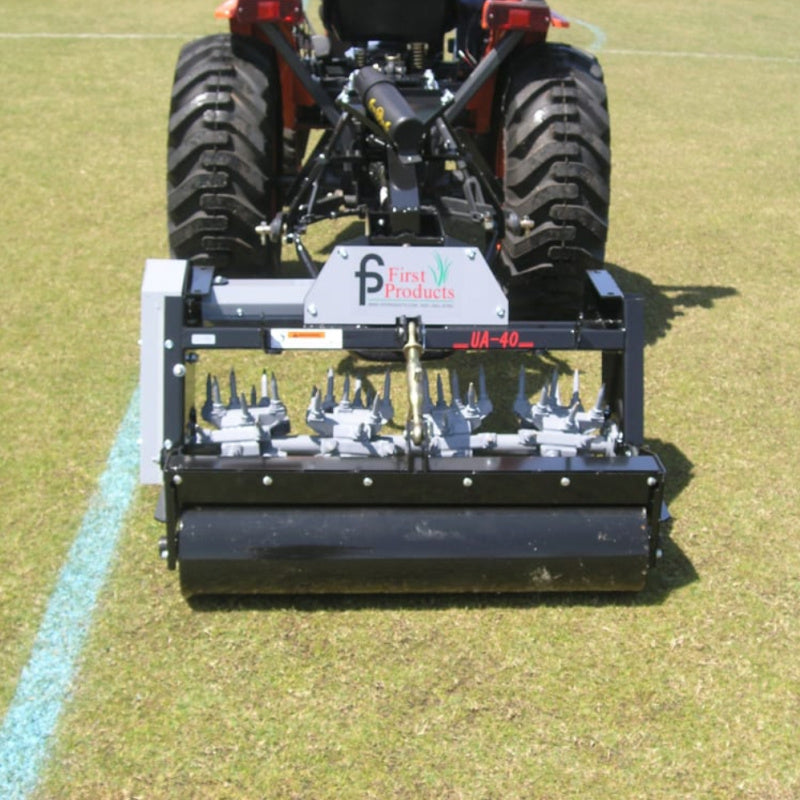 Rear view of multi tine shaft installed on the UA40Eara vator mounted on the tractor