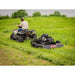 rear view of a man driving an ATV with Swisher 44 Inch Rough Cut Tow Behind Trail Cutter | RC14544CPKA