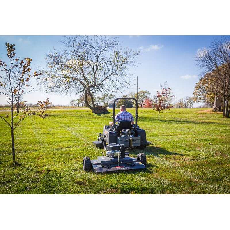 rear view of a man driving his lawn mower  with the FCE11544BS