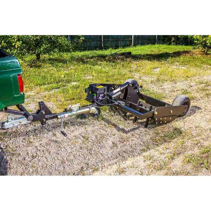 side view of a road buster driveway grader mounted on ATV