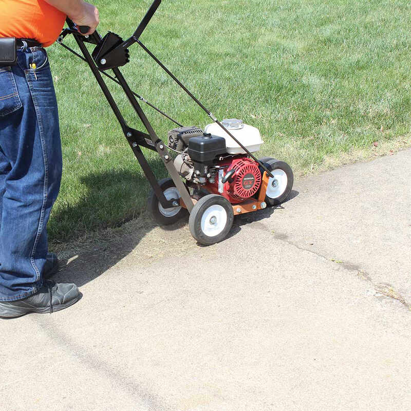 side view of a man in orange shirt operating the BravePro 10" Lawn Edger Honda GX120 (BRPE105H)