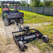 Rear view of a road buster driveway grader mounted on ATV