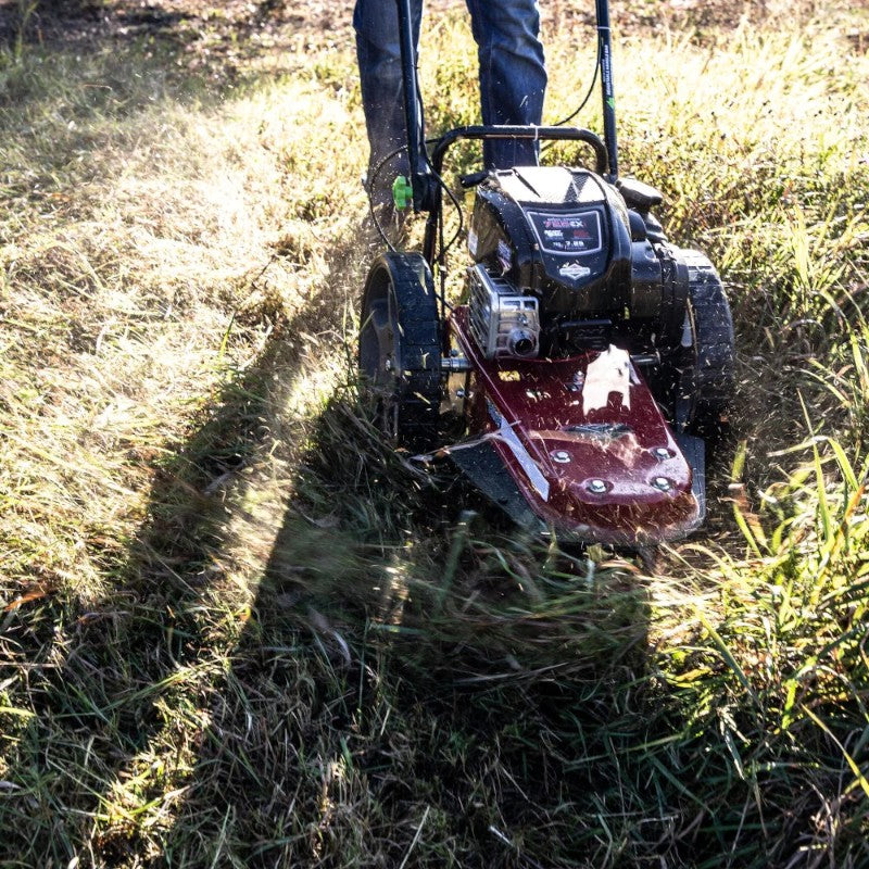 top view of earthquake walk behind string mower 163cc 4-cycle Briggs and Stratton Engine clearing lawn