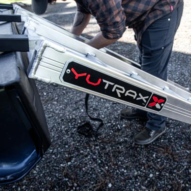 Yultrax company logo on the side of the alumimum loading ramp mounted on ATV